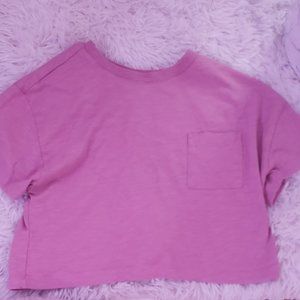 A light pink cropped shirt